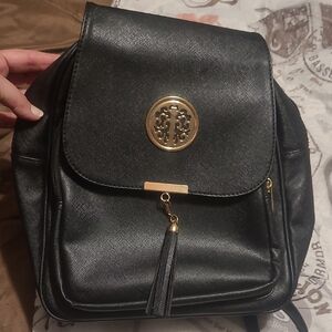 Chic Black Backpack with Gold Detailing